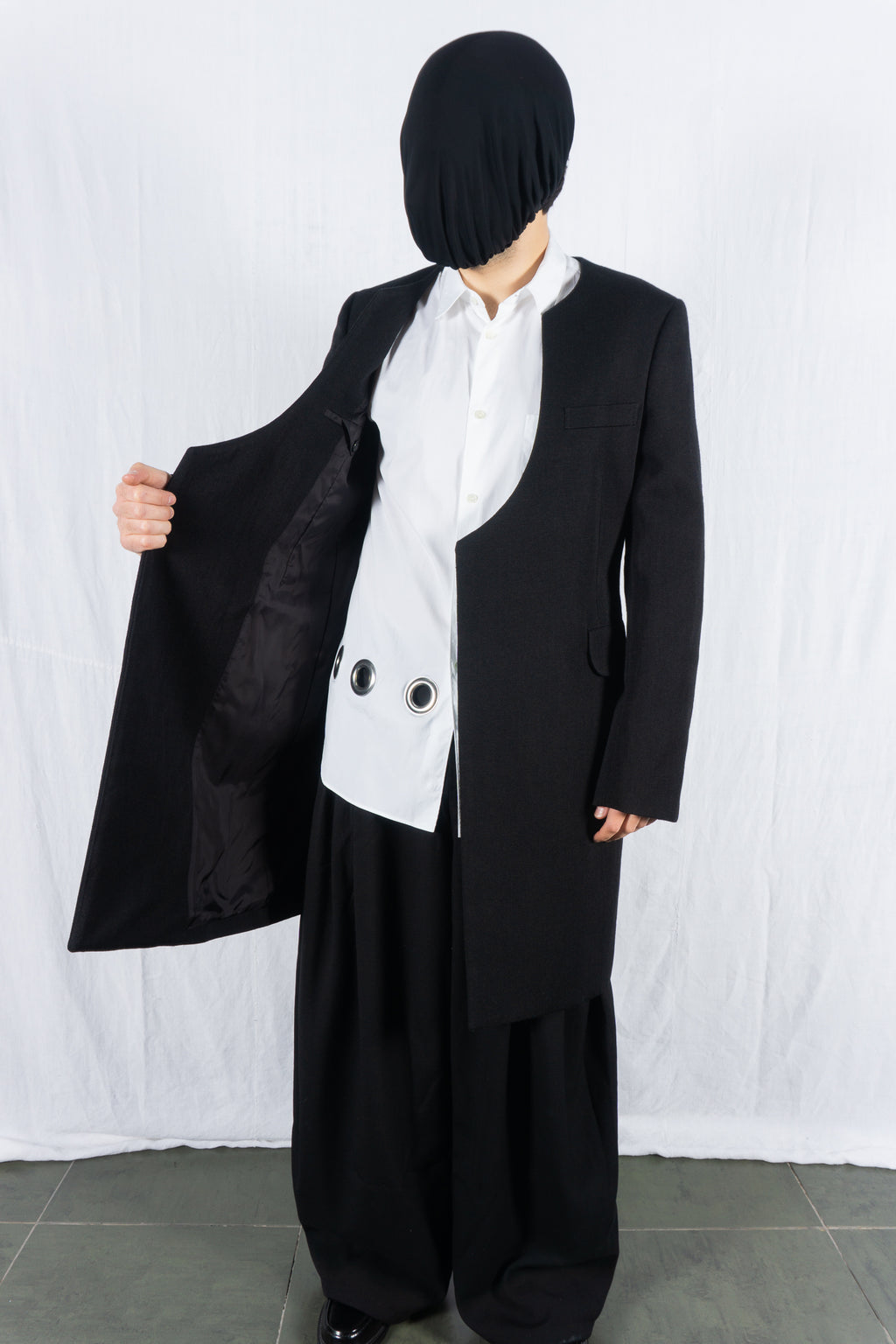 Comme des Garçons Homme Plus AW22 collarless coat – back view | Recente Studio