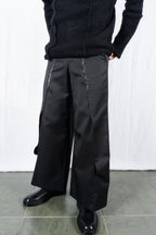Comme des Garçons Homme Plus A/W 2024 deconstructed pants – side view | Recente Studio