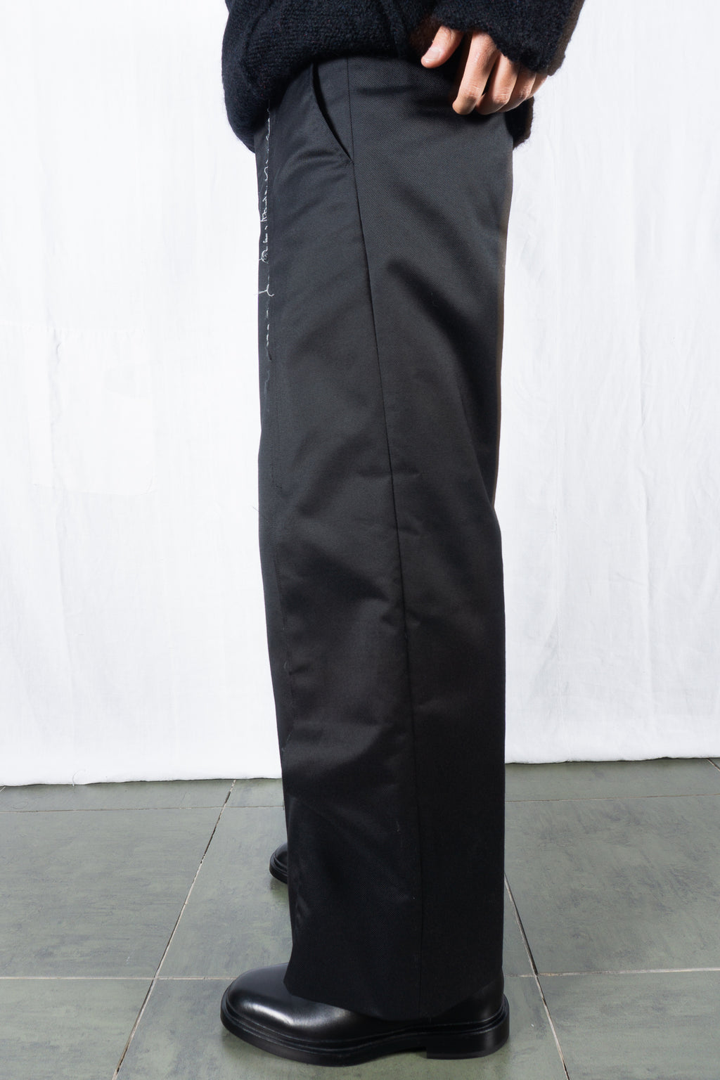 Comme des Garçons Homme Plus AW24 deconstructed pants – back view | Recente Studio