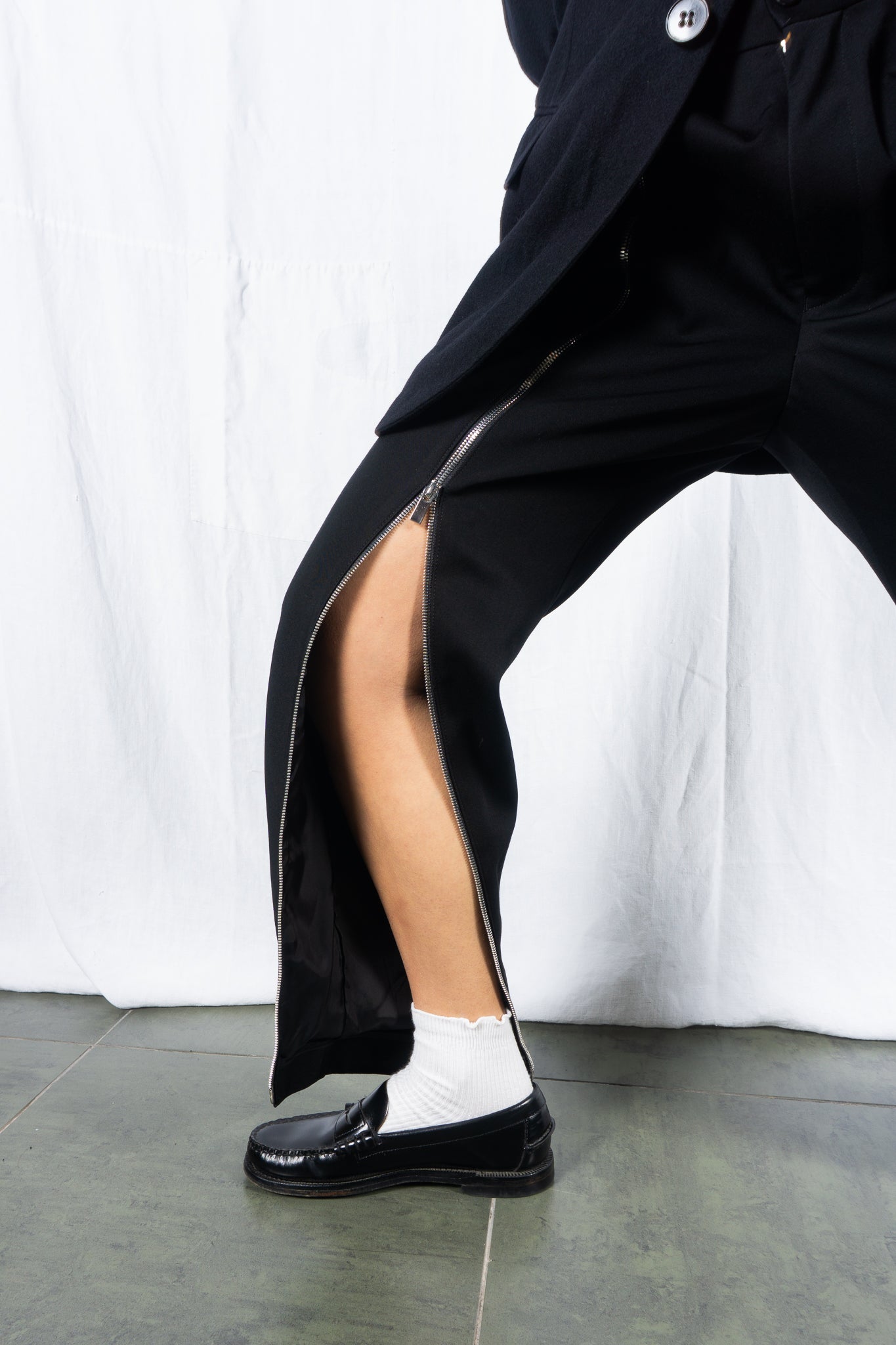 Noir Kei Ninomiya A/W 2022 zip pants – worn view | Recente Studio