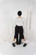 Noir Kei Ninomiya A/W 2023 cut pants – front view | Recente Studio