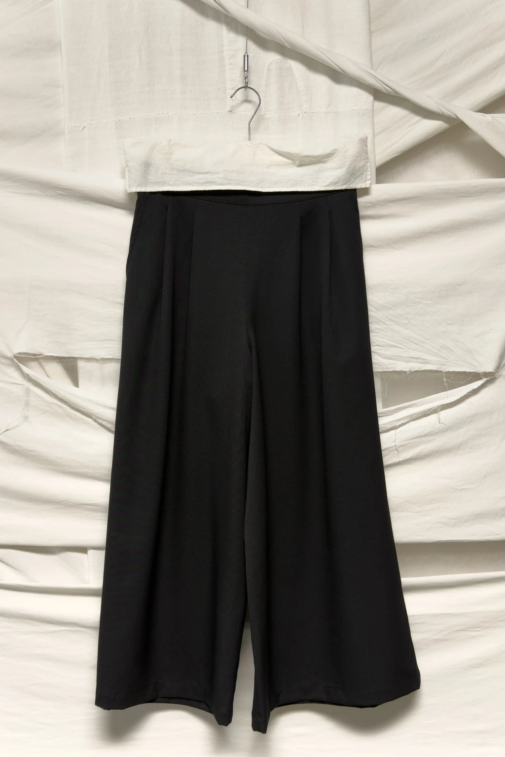 tricot Comme des Garçons A/W 2019 wide wool pants – garment on hanger | Recente Studio