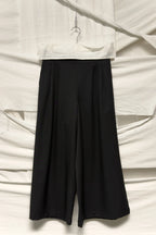 tricot Comme des Garçons A/W 2019 wide wool pants – garment on hanger | Recente Studio