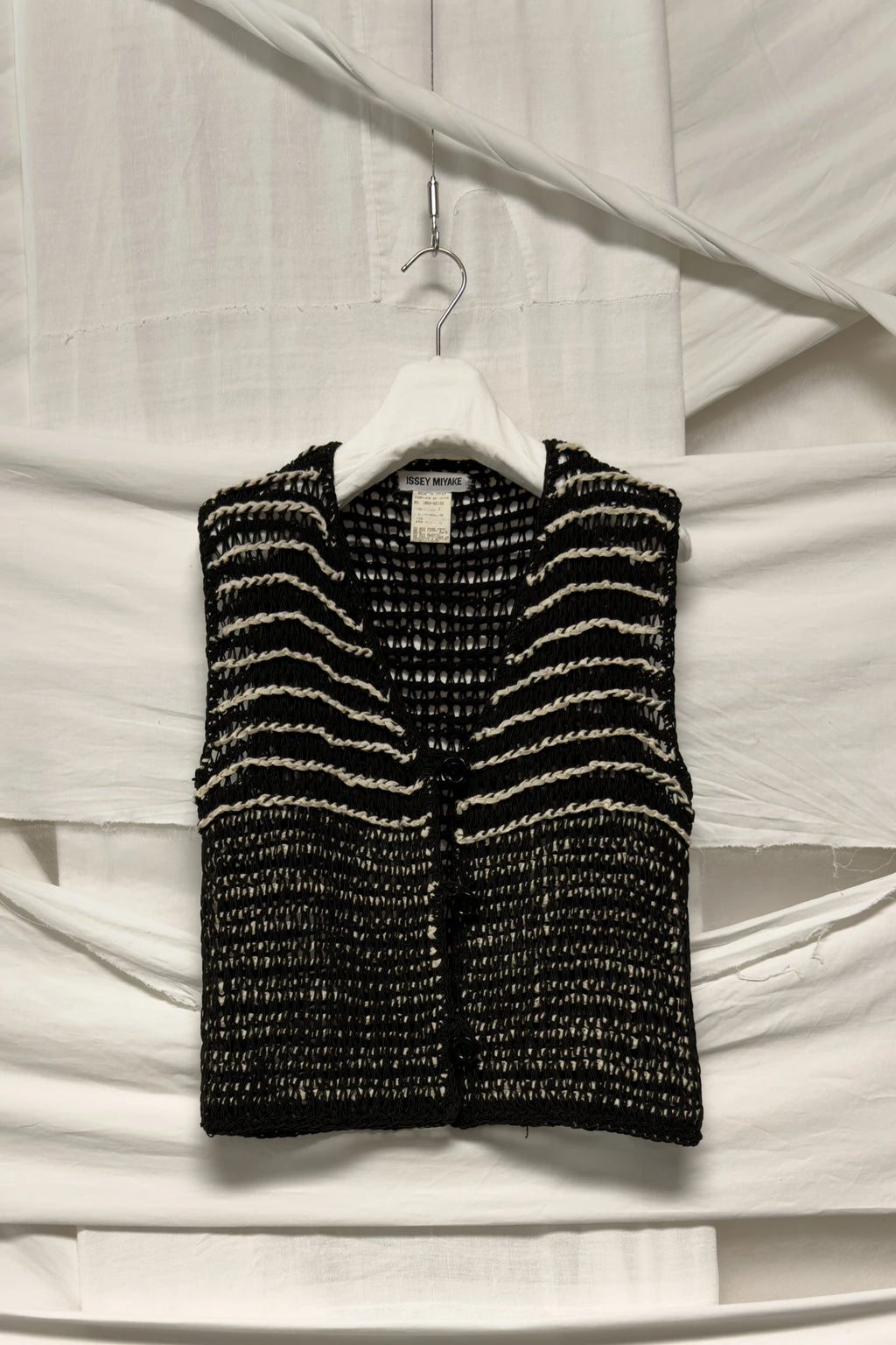 Issey Miyake crochet vest – garment on hanger | Recente Studio