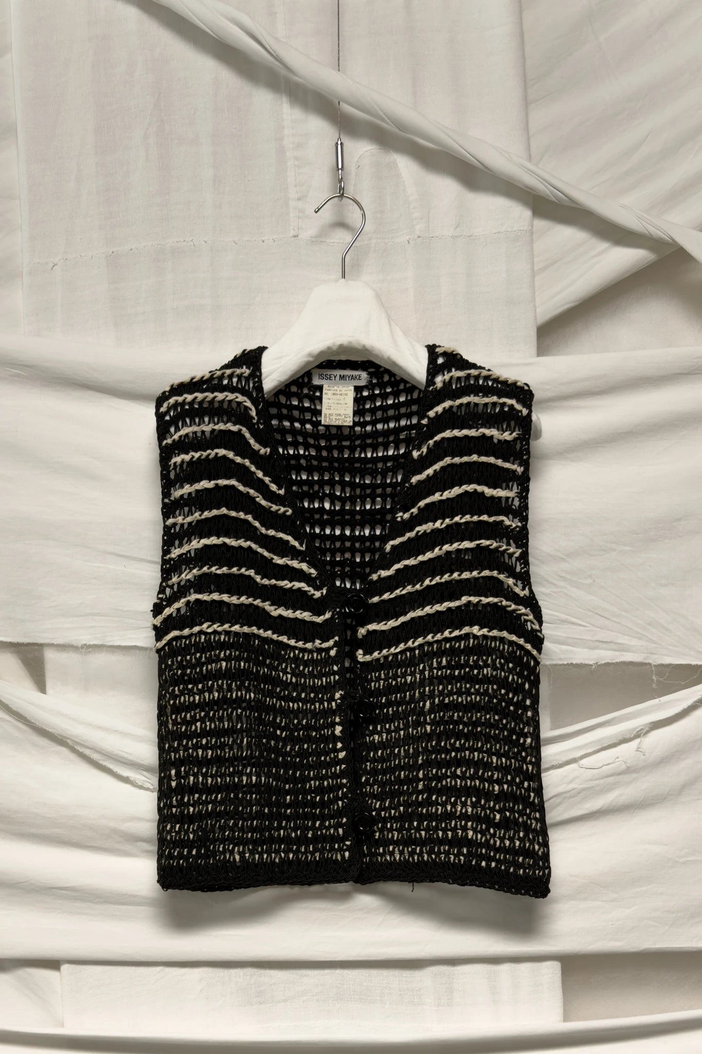Issey Miyake crochet vest – garment on hanger | Recente Studio