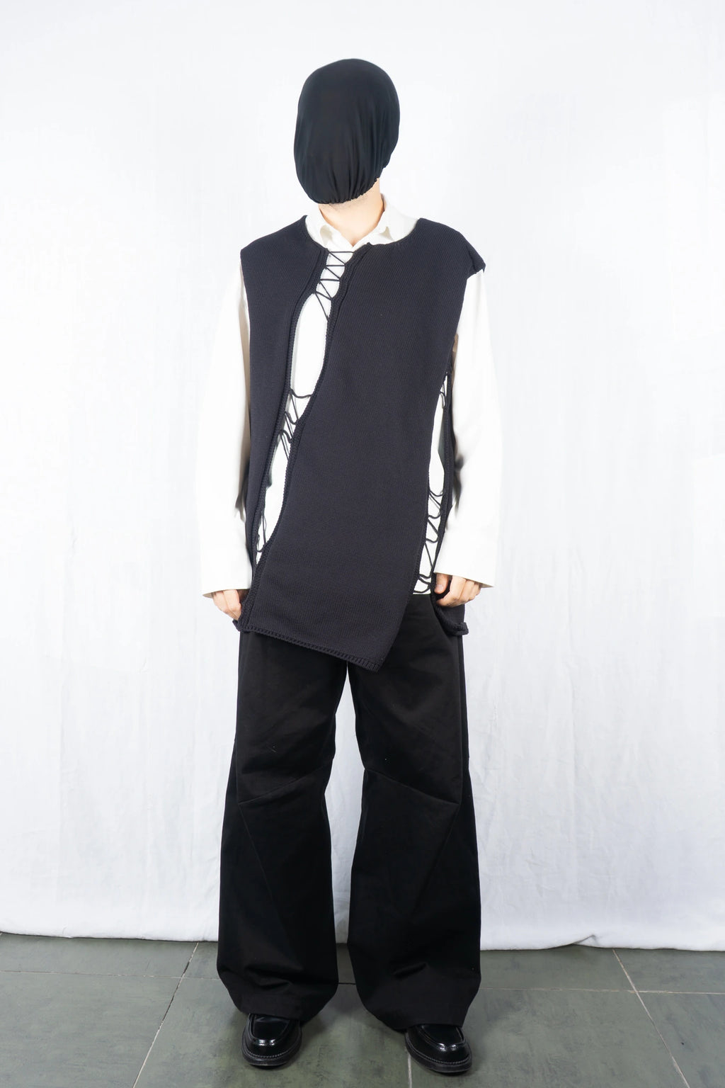 Comme des Garçons Homme Plus SS22 asymmetrical sleeveless sweater – side view | Recente Studio