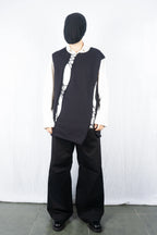 Comme des Garçons Homme Plus SS22 asymmetrical sleeveless sweater – side view | Recente Studio