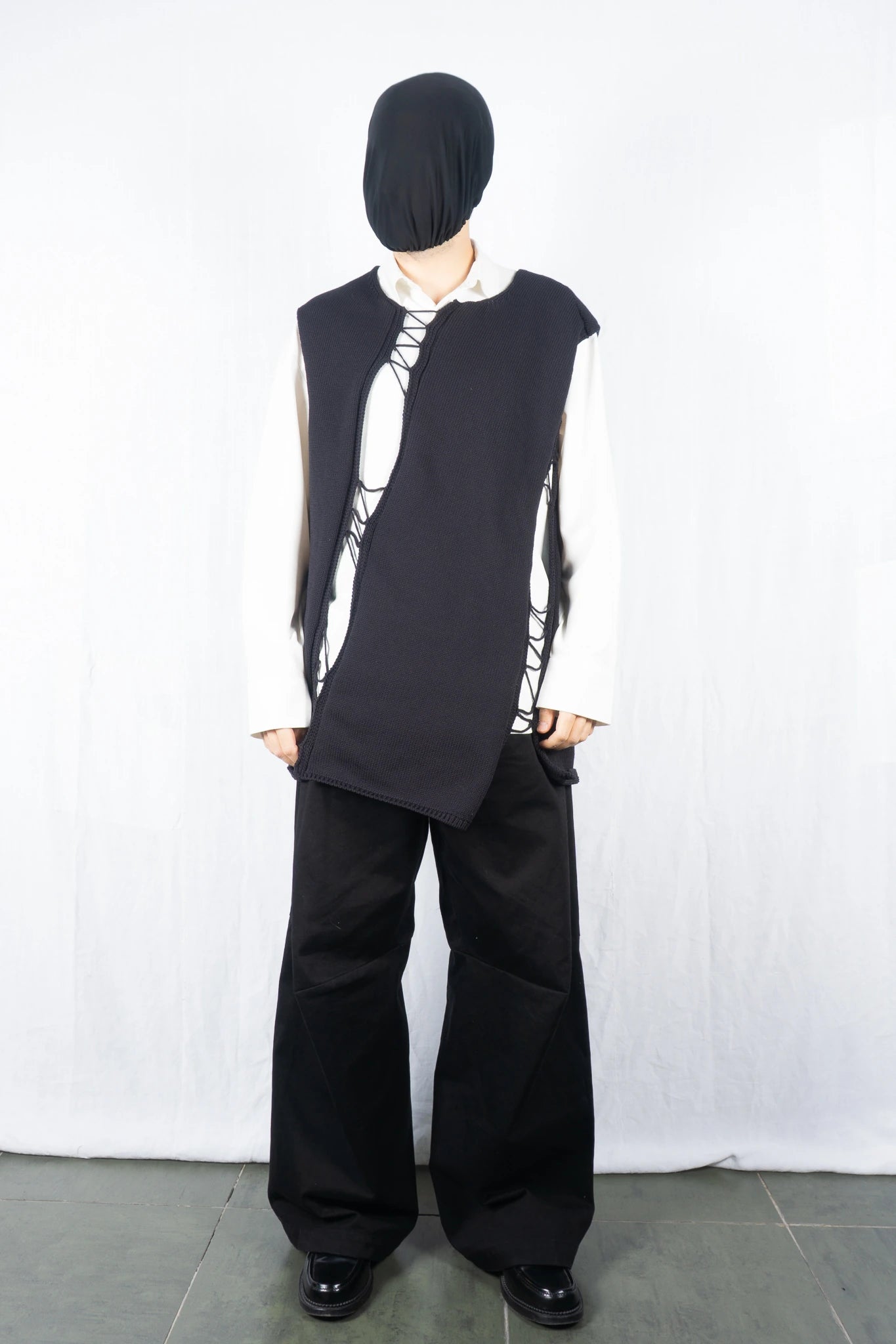 Comme des Garçons Homme Plus SS22 asymmetrical sleeveless sweater – side view | Recente Studio
