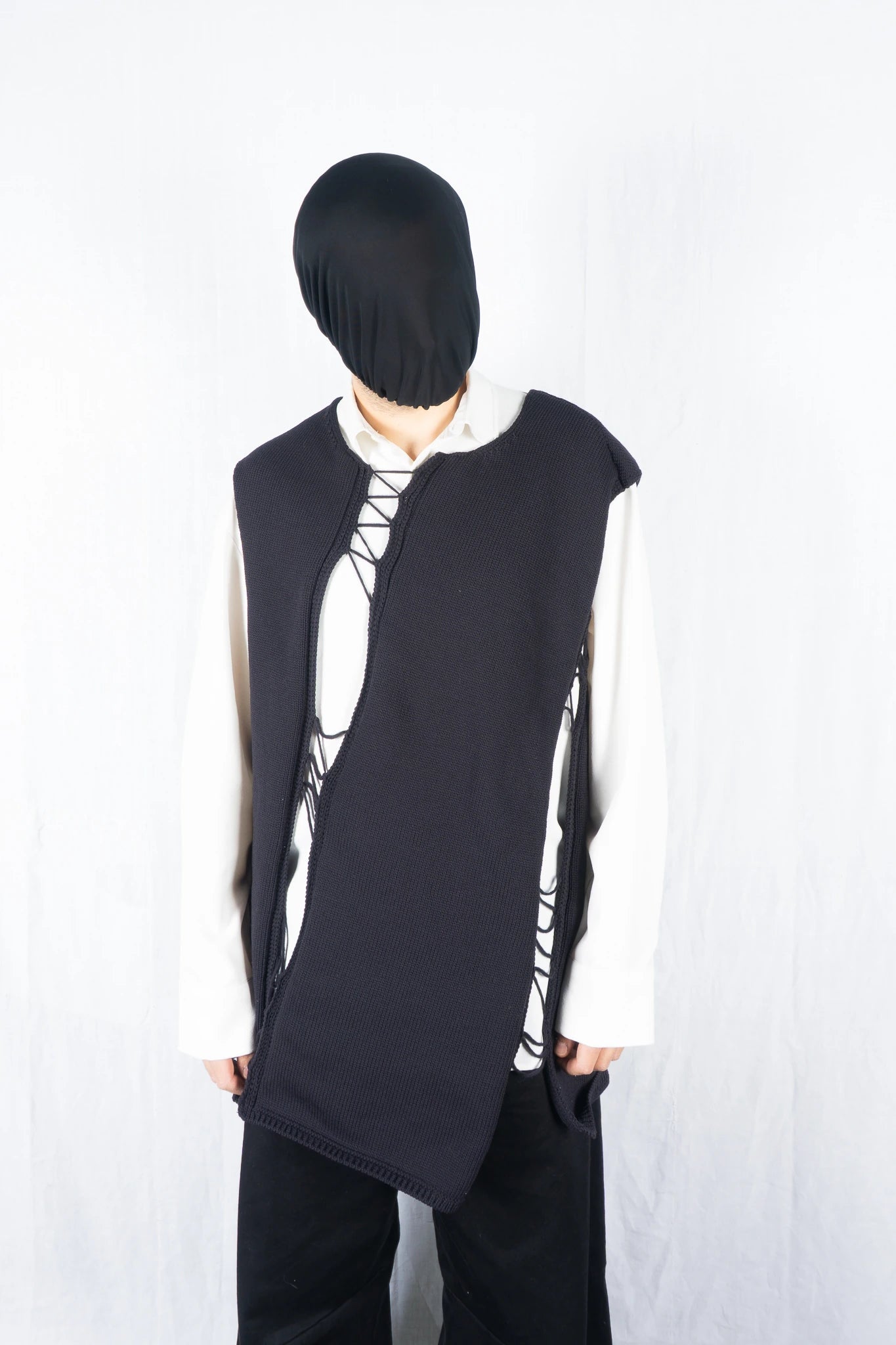 Comme des Garçons Homme Plus S/S 2022 asymmetrical sleeveless sweater – back view | Recente Studio