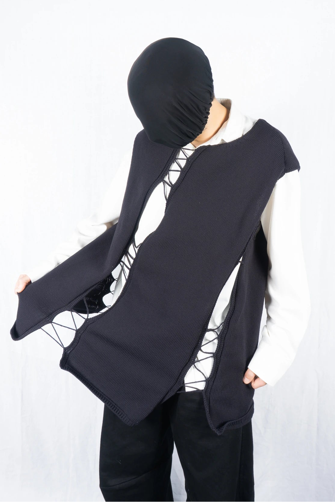 Comme des Garçons Homme Plus S/S 2022 asymmetrical sleeveless sweater – front view | Recente Studio