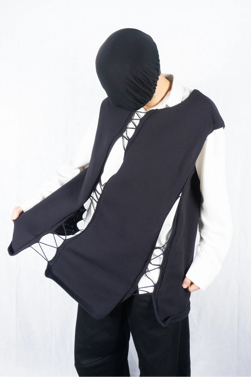 Comme des Garçons Homme Plus S/S 2022 asymmetrical sleeveless sweater – front view | Recente Studio